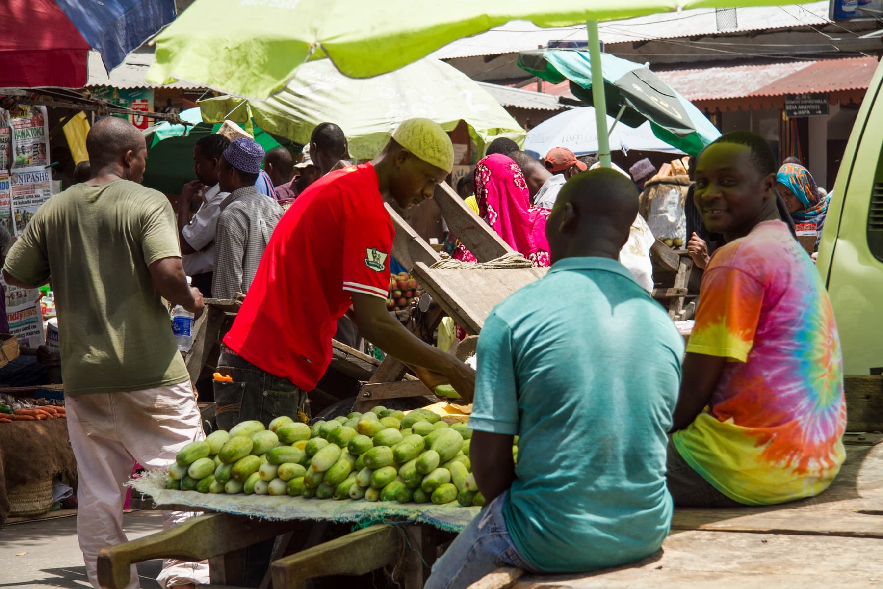 Natural leather mouse pad on white desk next to porcelain mug and keyboard.